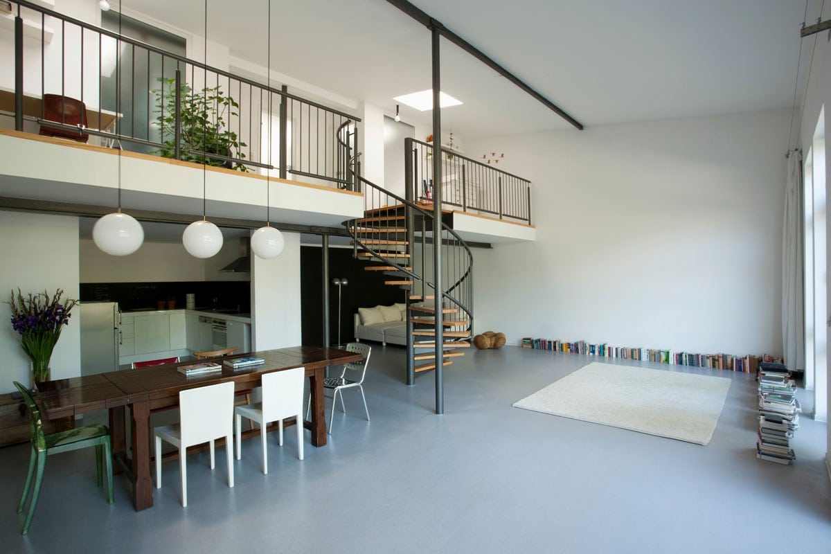 A modern open plan room with a mezzanine floor