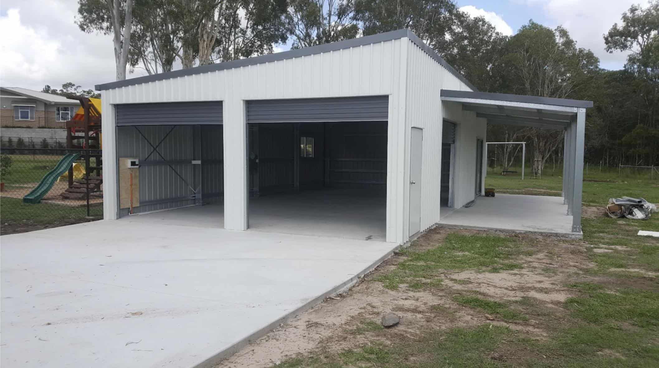 Metal shed with a double garage and carport layout.